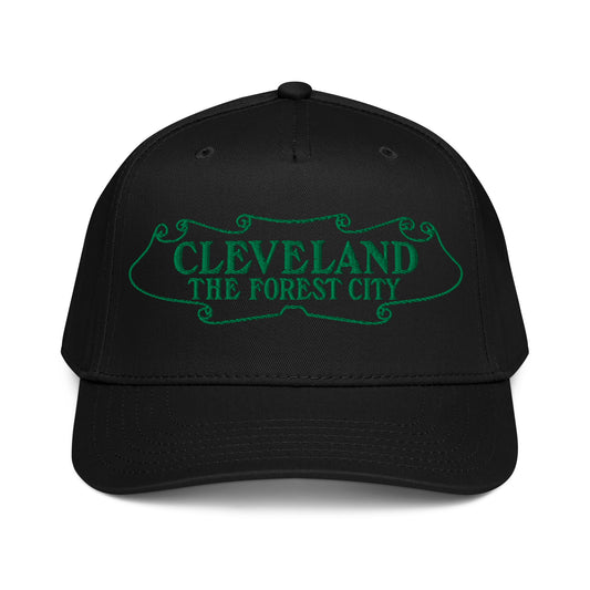 Black cap with green text 'CLEVELAND THE FOREST CITY' on a white background