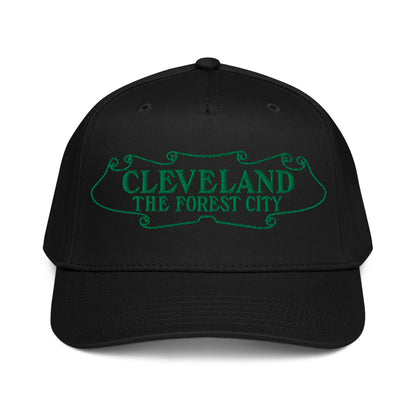 Black cap with green text 'CLEVELAND THE FOREST CITY' on a white background