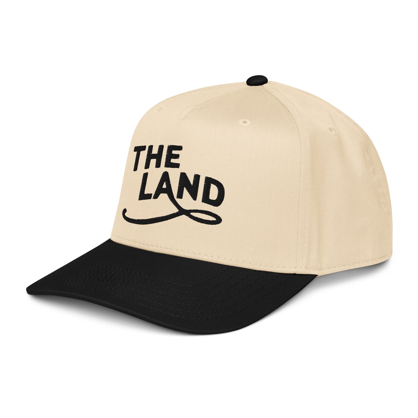 Beige and black cap with 'THE LAND' text on a white background