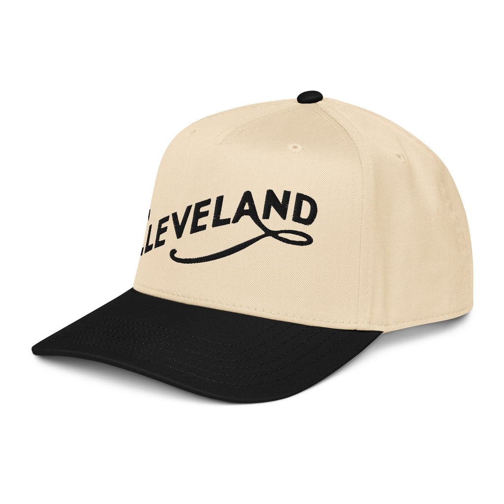 Beige and black cap with 'CLEVELAND' text on a white background