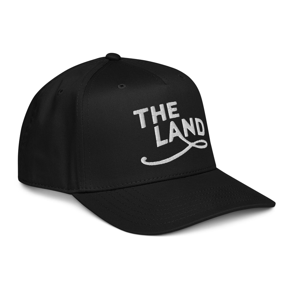 Black cap with 'THE LAND' text on a white background