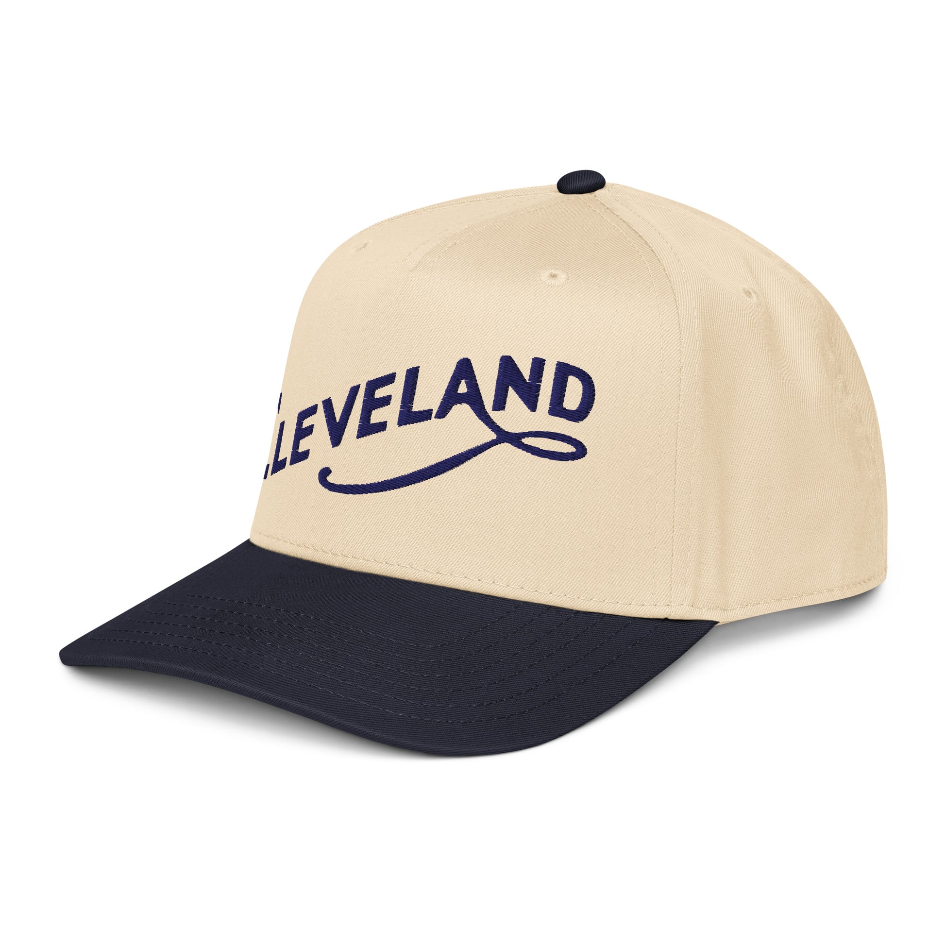 Beige and navy baseball cap with 'CLEVELAND' text on a white background
