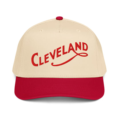 Beige and red cap with 'Cleveland' text on a white background