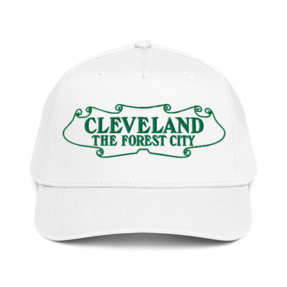 White cap with green text 'CLEVELAND THE FOREST CITY' on a white background