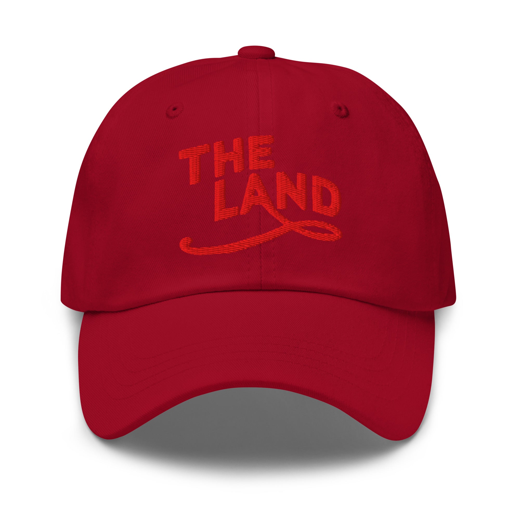 The Land Dad Cap in Cranberry with red embroidered The Land lettering, front view