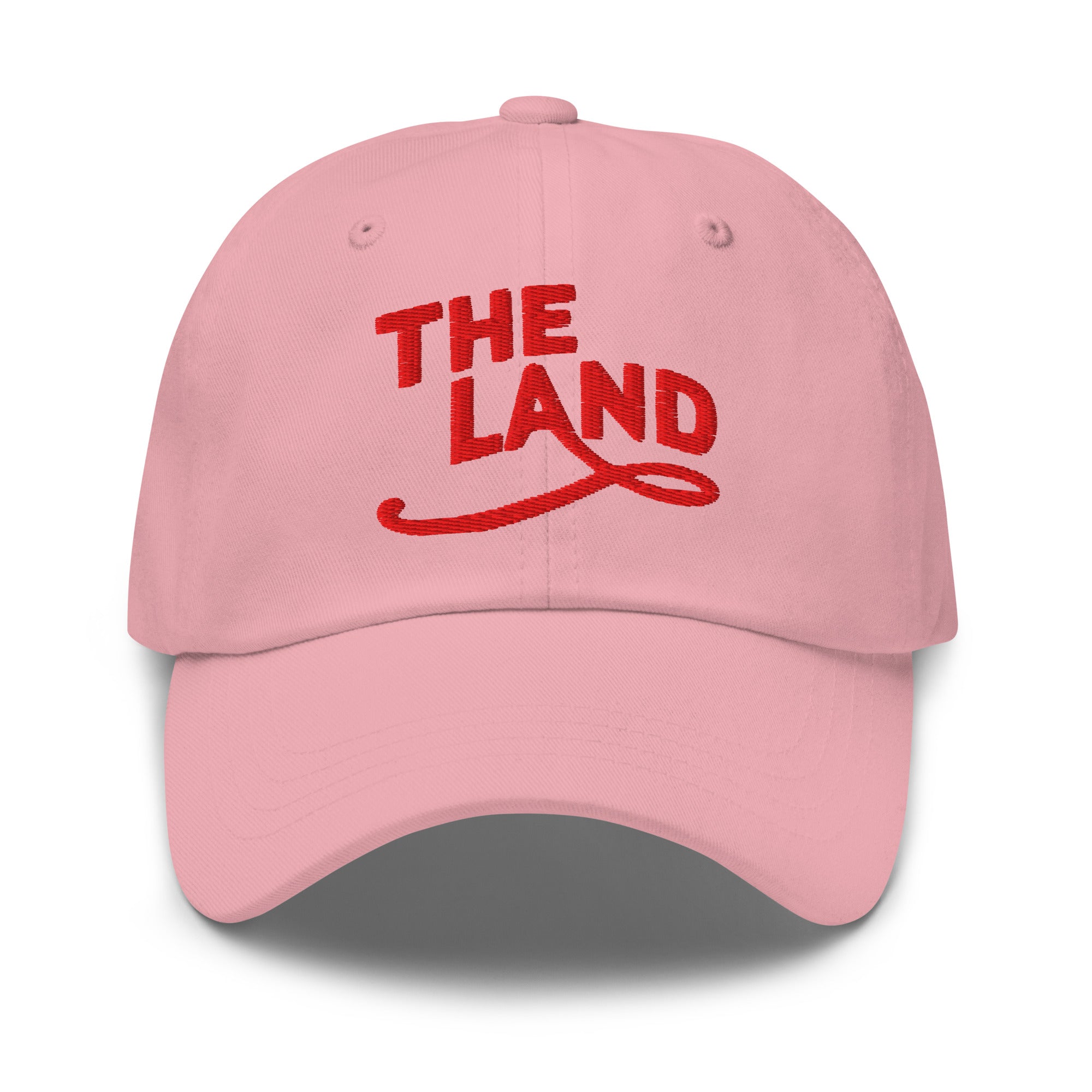 The Land Dad Cap in Pink with red embroidered The Land lettering, front view