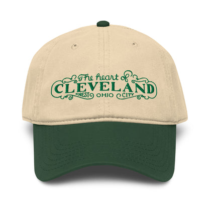 Beige and green cap with 'The heart of Cleveland, Forest City Ohio' text on a white background