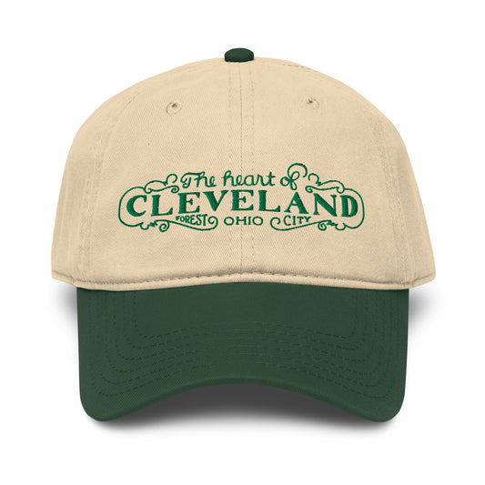 Beige and green cap with 'The heart of Cleveland, Forest City Ohio' text on a white background