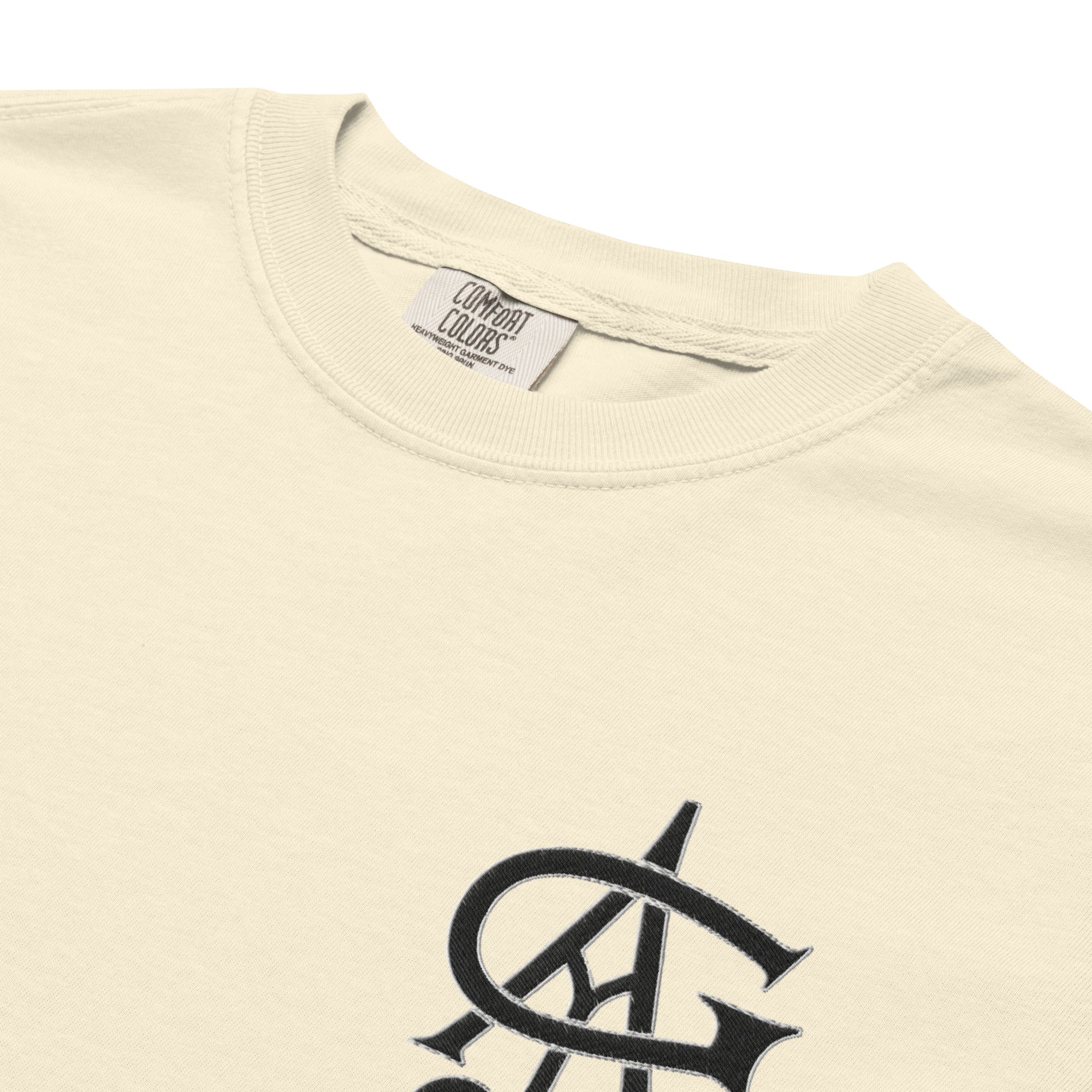 Beige t-shirt with a black logo and 'Comfort Colors' label on a white background